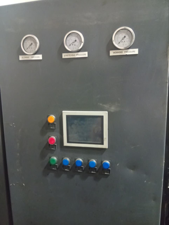 SMF COMBI 200 blow molding machine with glowing infrared preform oven, futuristic factory environment, engineering style, high-end industrial advertising, ultra realistic