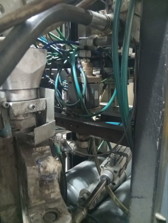 PET bottle manufacturing line with COMBI 200 machine, water and soft drink bottles, German engineering concept, dramatic lighting, premium industrial marketing artwork, Instagram reel cover ratio 9:16