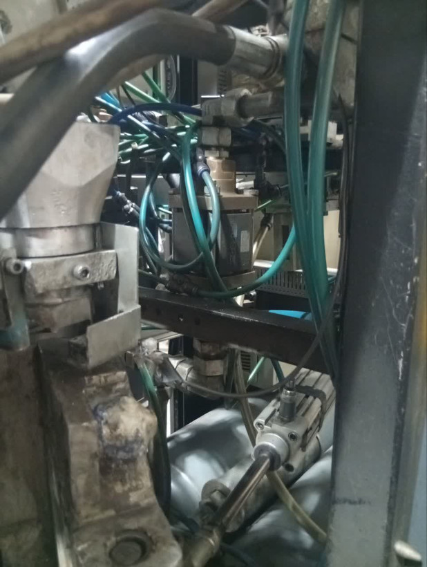 PET bottle manufacturing line with COMBI 200 machine, water and soft drink bottles, German engineering concept, dramatic lighting, premium industrial marketing artwork, Instagram reel cover ratio 9:16